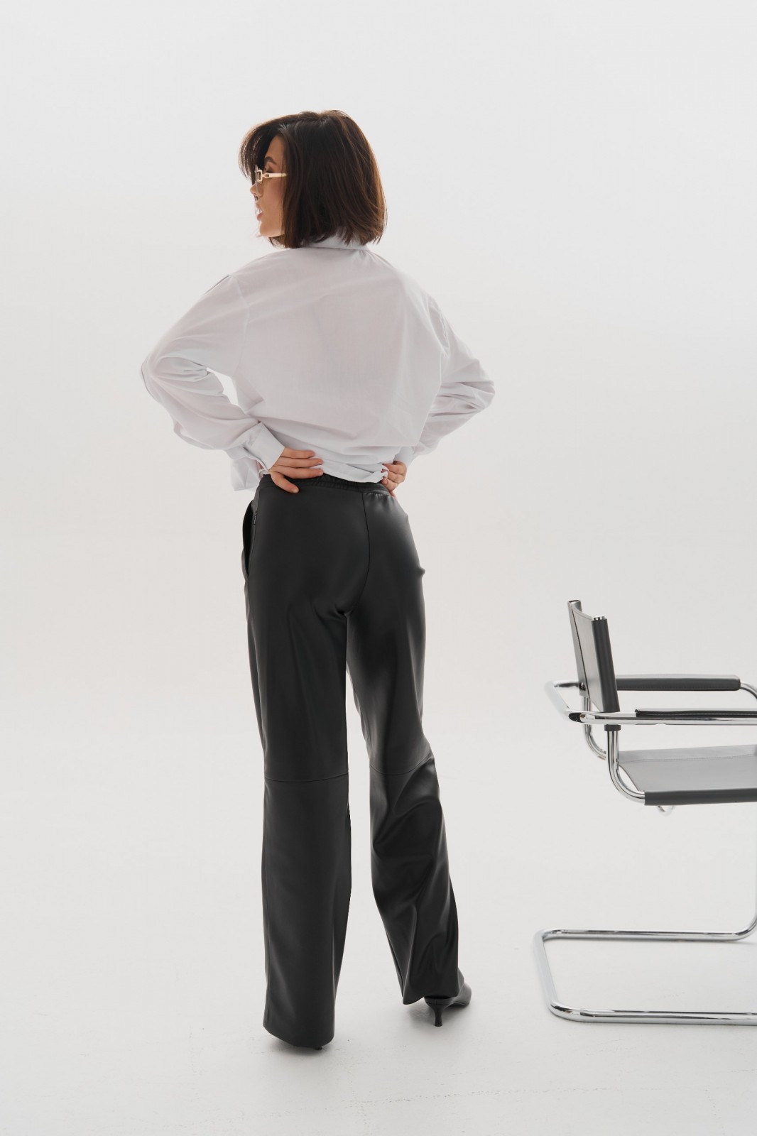 Жіночі штани палаццо з еко шкіри колір чорний р.S 450794